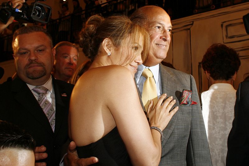 Singer Jennifer Lopez hugs  fashion designer Oscar De La Renta after a showing of his Spring 2009 collection during New York Fashion Week