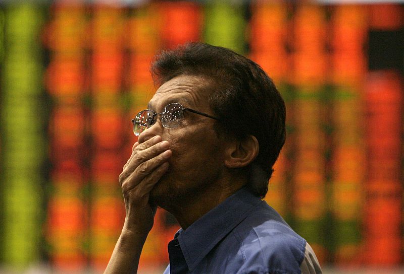 A trader reacts on a floor of the Philippine Stock Exchange in Makati's financial district of Manila