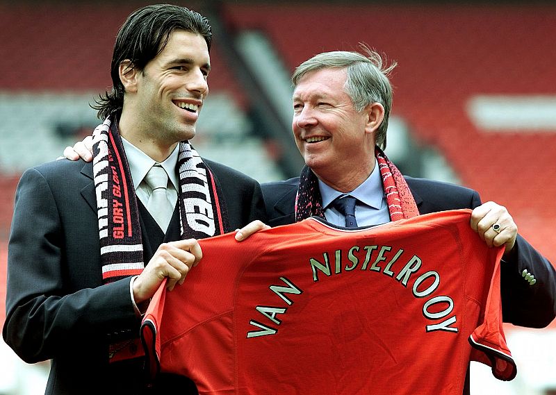 DUTCH STRIKER RUUD VAN NISTELROOY POSES FOR PHOTOGRAPHERS HOLDING A MANCHESTER UNITED SHIRT WITH COACH ...