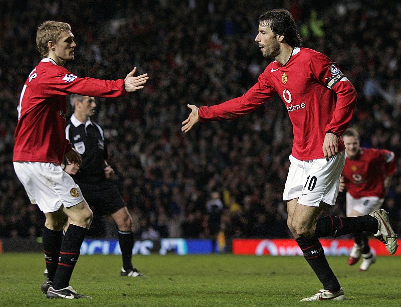 Manchester United's van Nistelrooy celebrates his goal against West Ham United with Fletcher during their English Premier League match in Manchester