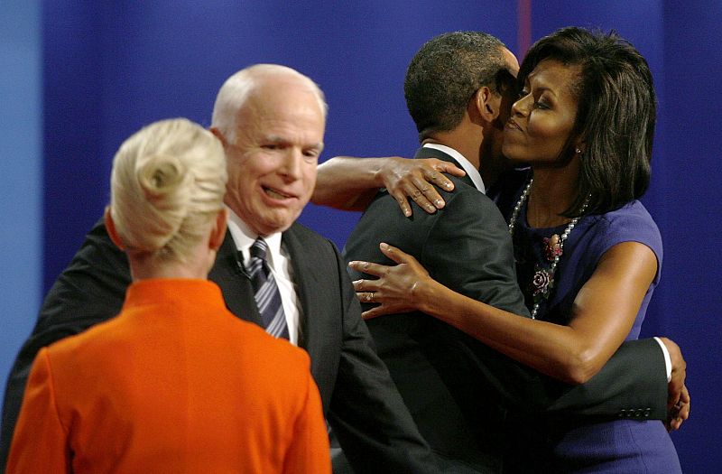 Obama and McCain greet their wives onstage as they conclude their presidential debate at Hofstra University in Hempstead, New York