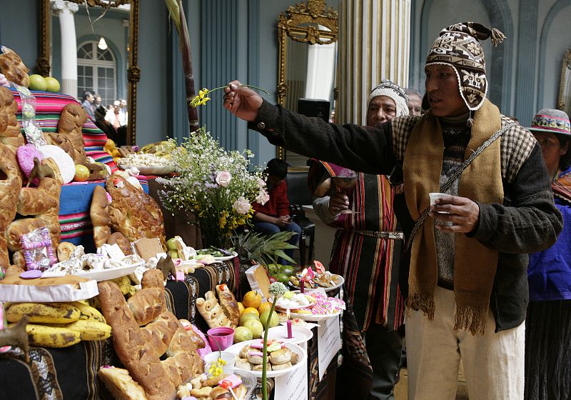 A witch doctor blesses traditional ornaments of  All Saints Day at the foreign ministry building in La Paz