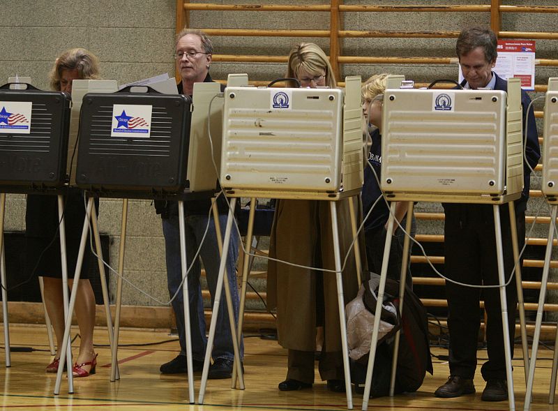 Bill Ayers checks his ballot as he casts his vote  in Chicago