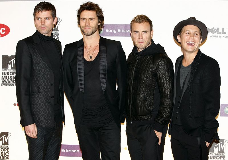 British band Take That pose on the red carpet before the MTV Europe Music Awards ceremony in Liverpool