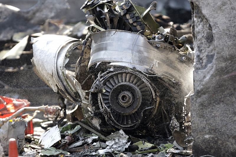 Debris is seen at the scene of a plane crash in Mexico City