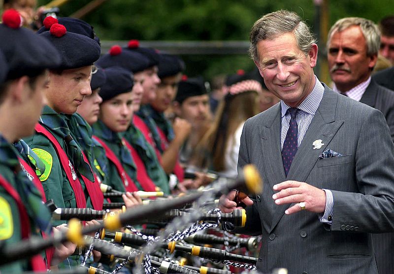 PRINCE CHARLES INSPECTS PIPERS AT CHARITY PIPING EVENT.