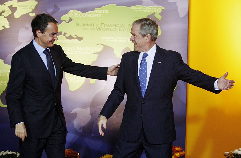 U.S. President Bush greets Spain's PM Zapatero at G20 Summit in Washington