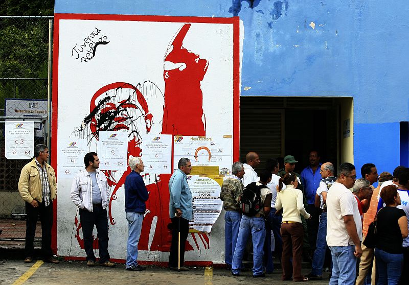 People line up to cast their votes at a polling station in Caracas