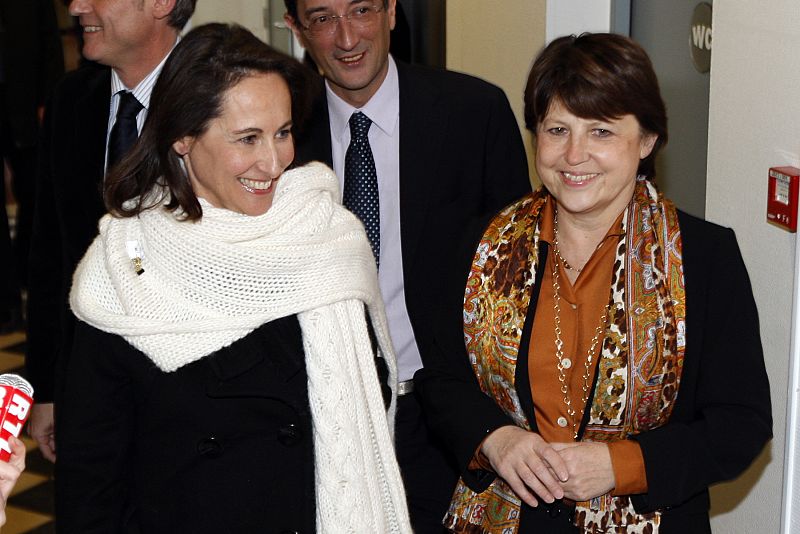 Segolene Royal, ex-presidential candidate (L) is greeted by Martine Aubry the new leader of the opposition party at the party headquarters in Paris