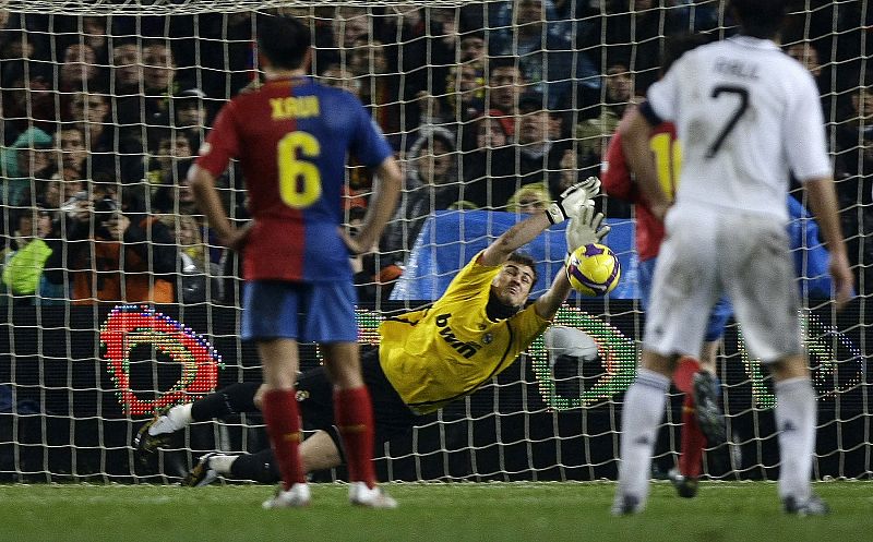 Real Madrid's goalkeeper Casillas saves penalty shot during their Spanish First Division soccer match in Barcelona