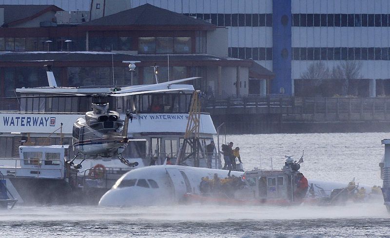 Passengers are rescued after a U.S. Airways plane landed in the Hudson River in New York