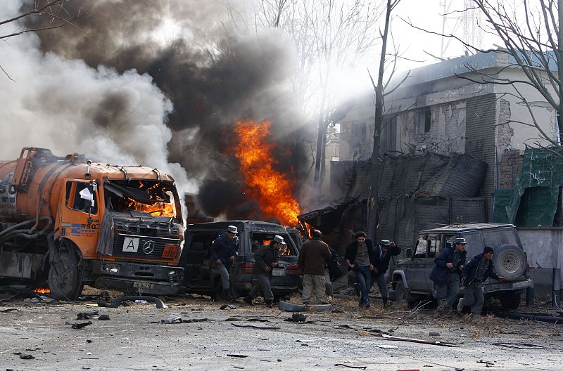People run after a blast outside the German embassy in Kabul