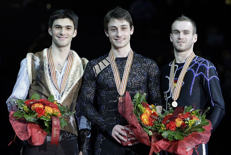 Contesti of Italy Joubert of France and Van Der Perren of Belgium pose with medals after men's free skating program at European Figure Skating Championships in Helsinki