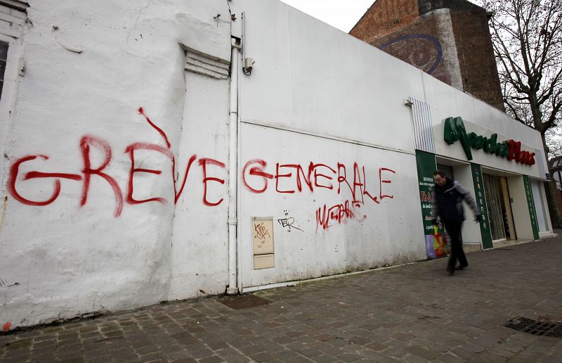 A customer leaves a supermarket in Lille