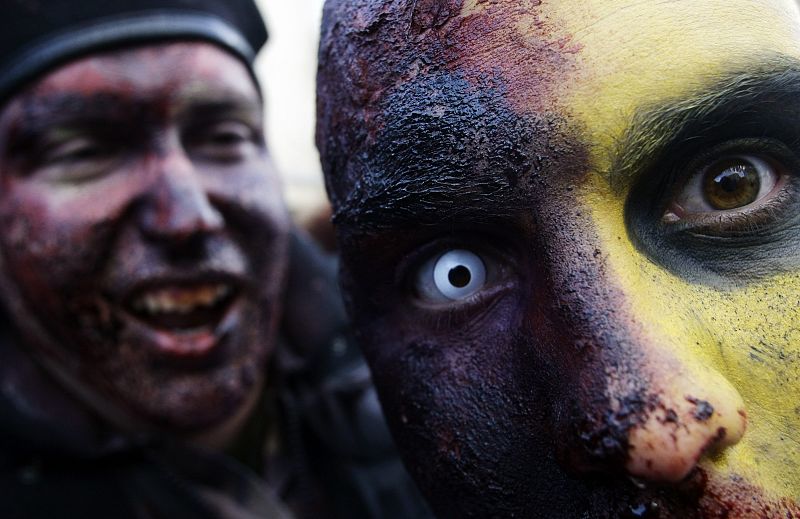 People dressed like Zombies take part in a Zombie gathering in Madrid