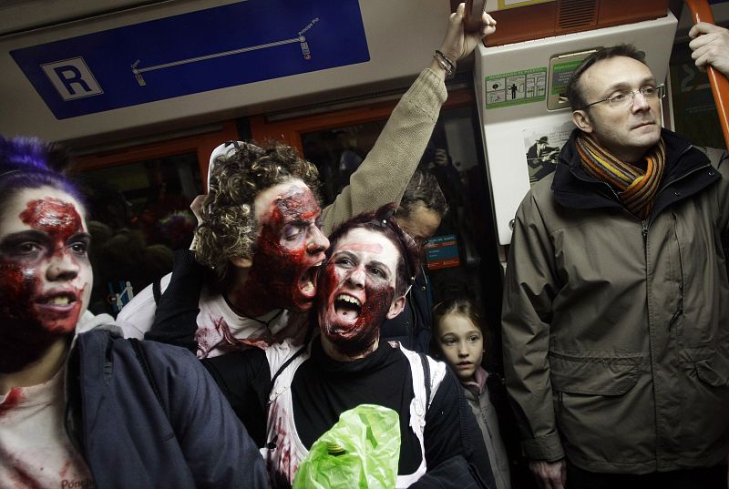 People dressed like zombies ride the subway in Madrid
