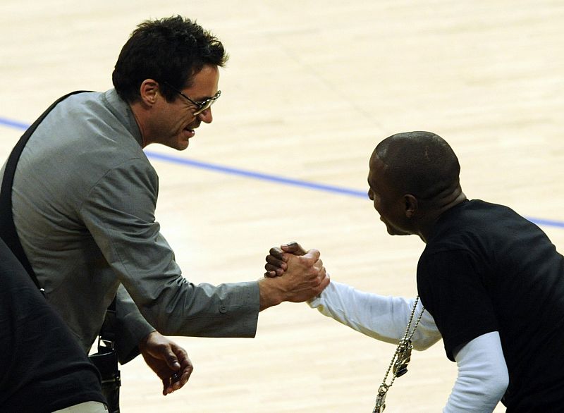 Actor Robert Downey Jr. and boxer Floyd Mayweather greet each other at Game 5 of the NBA Finals in Los Angeles