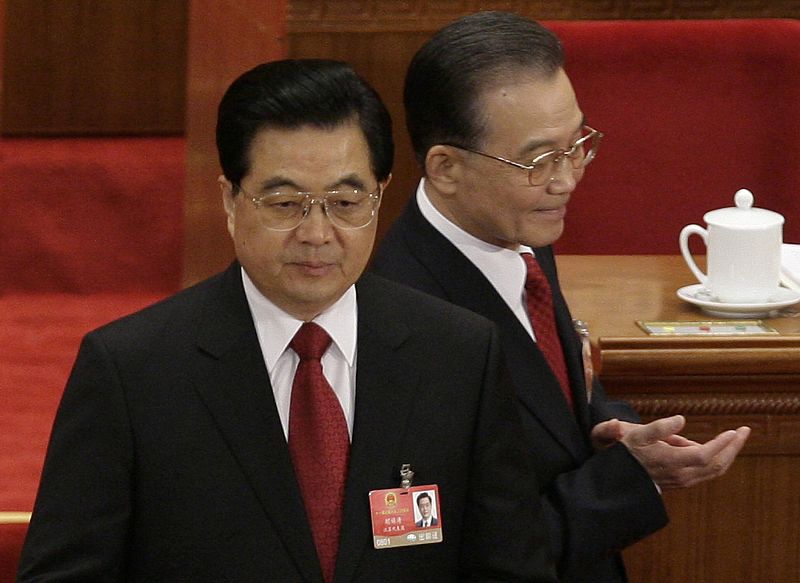 China's Premier Wen walks past President Hu ahead of the opening ceremony of NPC at the Great Hall of the People in Beijing