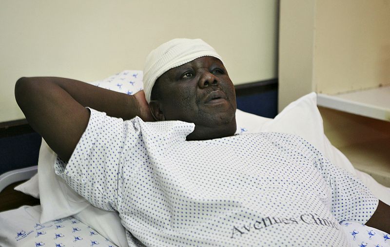 Zimbabwe's Prime Minister Morgan Tsvangirai lies in a hospital bed in Harare