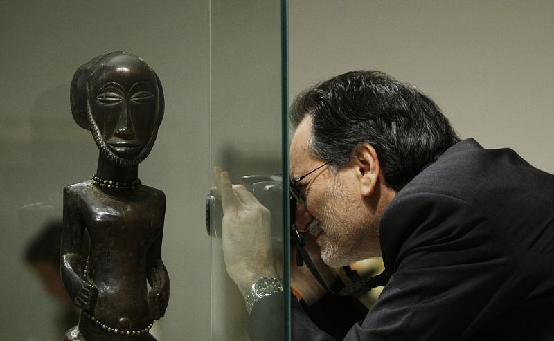 Man takes photographs during media presentation of exhibition "Maurice de Vlaminck, a Fauve Instinct" at Madrid's Caixa Forum museum