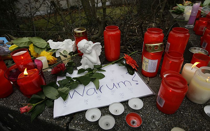 Candles are placed near the Albertville-Realschule school where a shooting incident took place in Winnenden