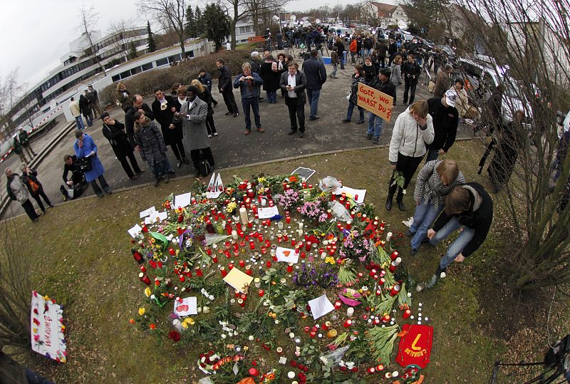 Students mourn at the Albertville-Realschule school where a shooting incident took place in Winnenden