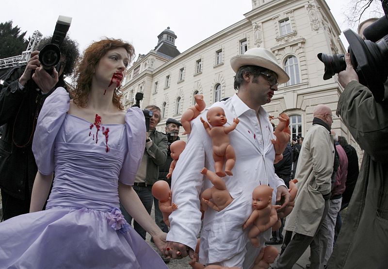 Actors staging a performance in front of the court of law in Sankt Poelten