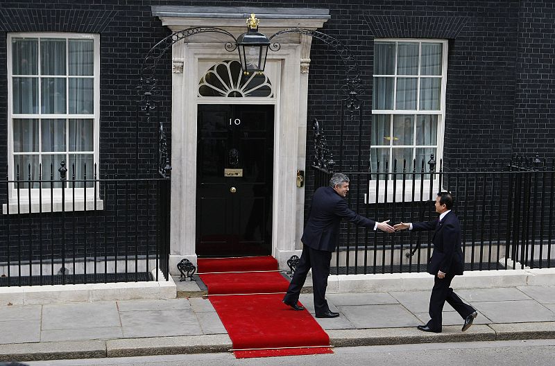 Britain's PM Brown greets his Japanese counterpart Aso outside 10 Downing Street in London