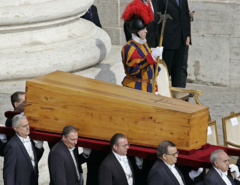 Pallbearers carry the coffin with the remains of the late Pope John Paul II at the start of ...