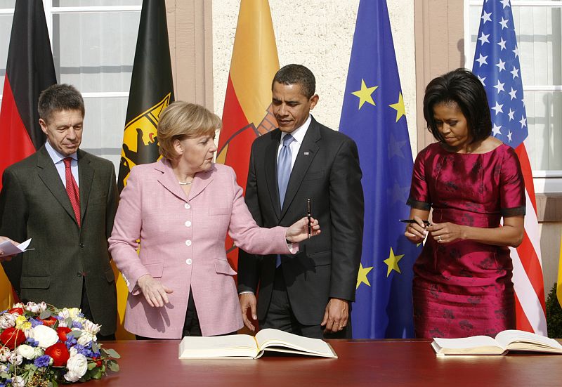 U.S. President Obama and first lady Michelle Obama attend the golden book signing ceremony with German Chancellor Merkel and her husband Sauer in Baden-Baden