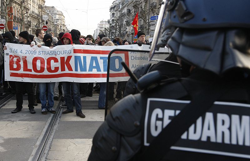 French riot police block anti-NATO demonstrators next to the congress centre where leaders are meeting in Strasbourg