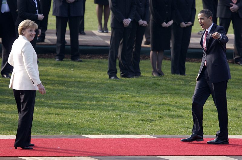 German Chancellor Merkel welcomes US President Obama as he arrives at the "Two Banks Bridge" on the Rhine river in Kehl