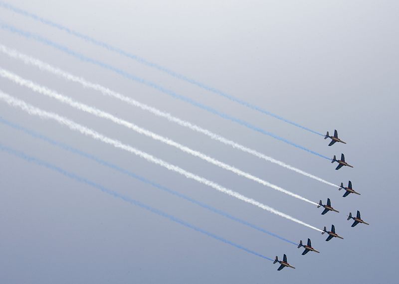 French air force jets fly in formation over the Two Banks Bridge on the Rhine river during a ceremony in Strasbourg