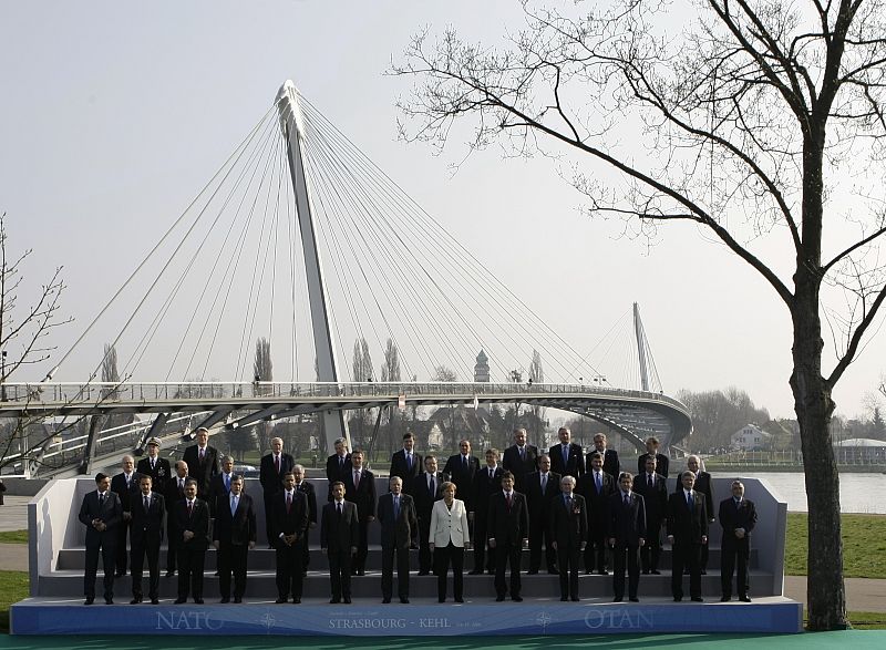 NATO leaders pose for a family picture in front of the Two Banks Bridge on the Rhine river in Strasbourg