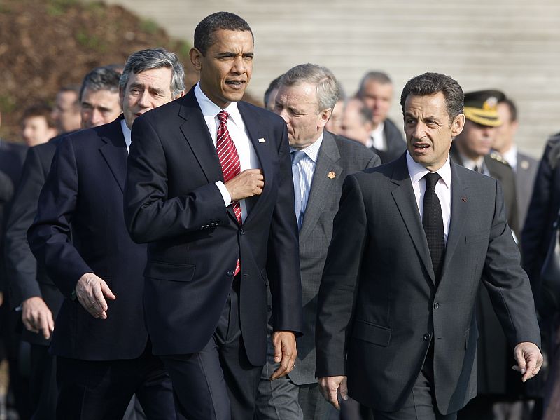 Britain's Prime Minister Brown, U.S. President Obama, NATO Secretary General de Hoop Scheffer and French President Sarkozy  walk after a minute of silence to honour NATO military personnel for service in operational theatres, in Strasbourg