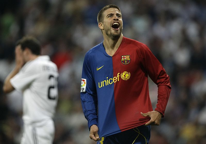 Barcelona's Pique celebrates his goal against Real Madrid during their Spanish first division match in Madrid