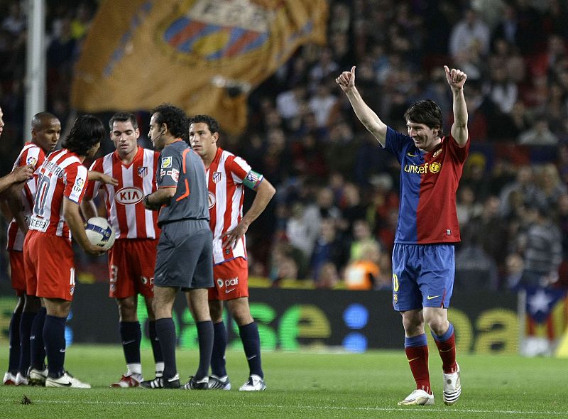 Barcelona's Lionel Messi celebrates his goal against Atletico Madrid during their Spanish first division soccer match at Nou Camp stadium in Barcelona