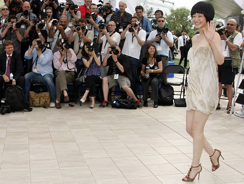 Cast member Zhuo Tan poses during a photocall for the film "Chun Feng Chen Zui De Ye Wan" at the 62nd Cannes Film Festival