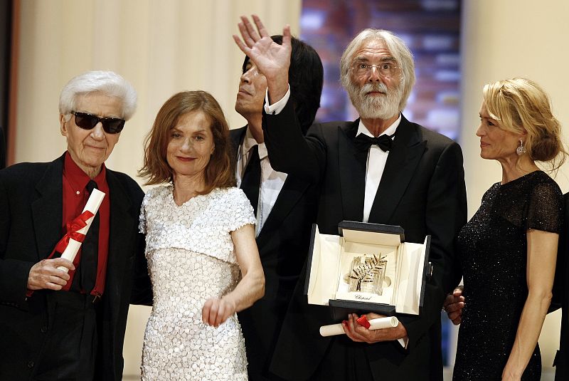 Director Michael Haneke celebrates after receiving the Palme d'Or award at the 62nd Cannes Film Festival