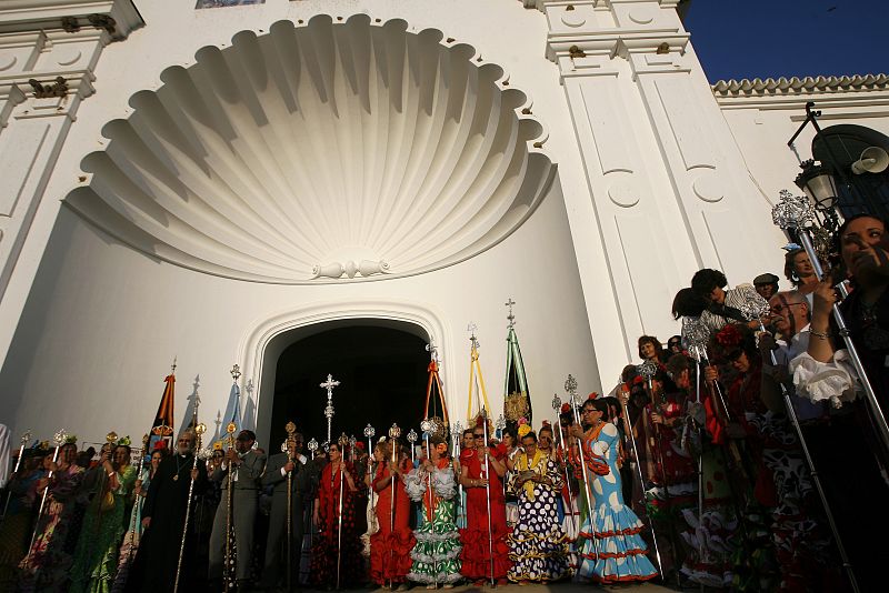 Pilgrims pray together outside the shrine of El Rocio in Almonte, southern Spain