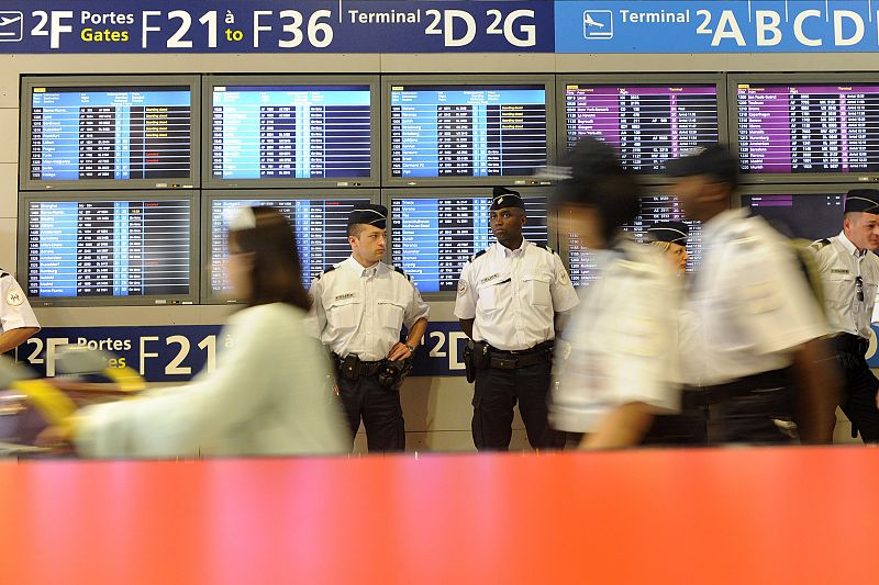 Police stand guard at Charles de Gaulle airport near Paris after Air France flight from Brasil disappeared from radar