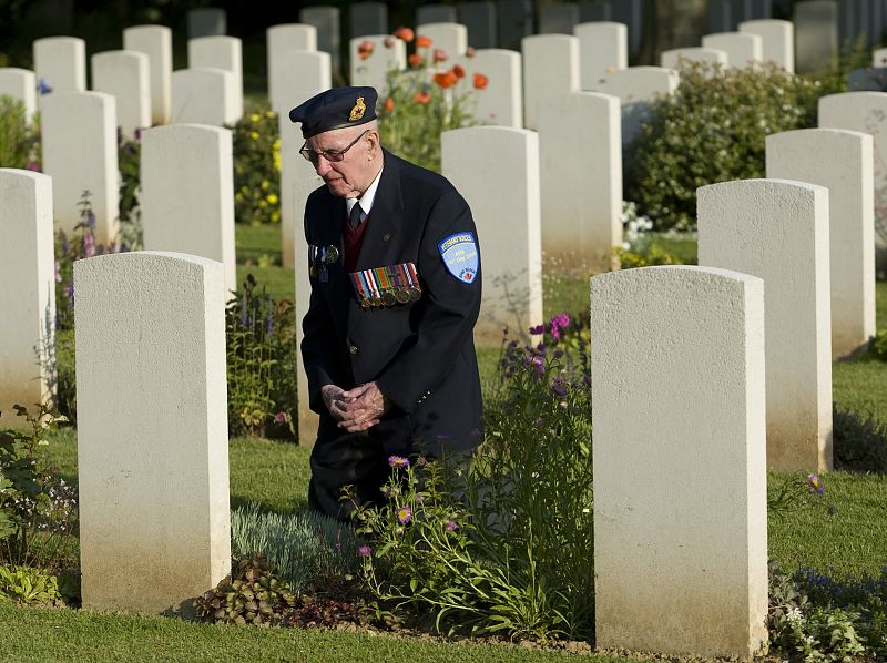 Canadian veteran of the Normandy D-Day invasion Macdonald visits the grave of his brother 65 years after he was killed in Beny-sur-Mer