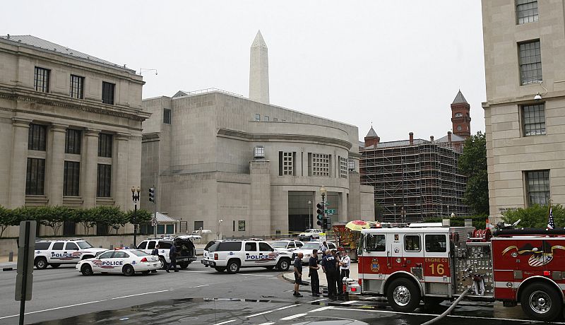 Washington police, firefighters and other law enforcement officials gather at the scene of a shooting at the U.S. Holocaust Museum in Washington