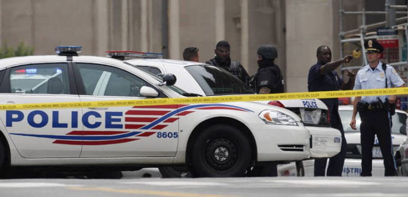 Washington police and SWAT team members secure the scene outside the U.S. Holocaust Museum after a shooting inside the museum in Washington