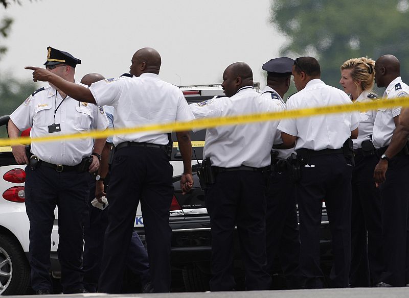 Washington police officers gather outside the U.S. Holocaust Museum after a shooting inside the museum in Washington