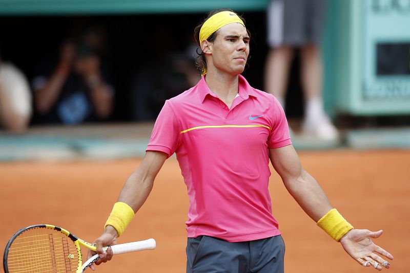 Rafael Nadal reacts during his match against Robin Soderling at the French Open tennis tournament at Roland Garros in Paris