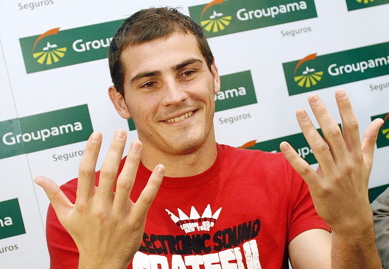 Real Madrid's goalkeeper Casillas shows off his hands during a news conference in Madrid
