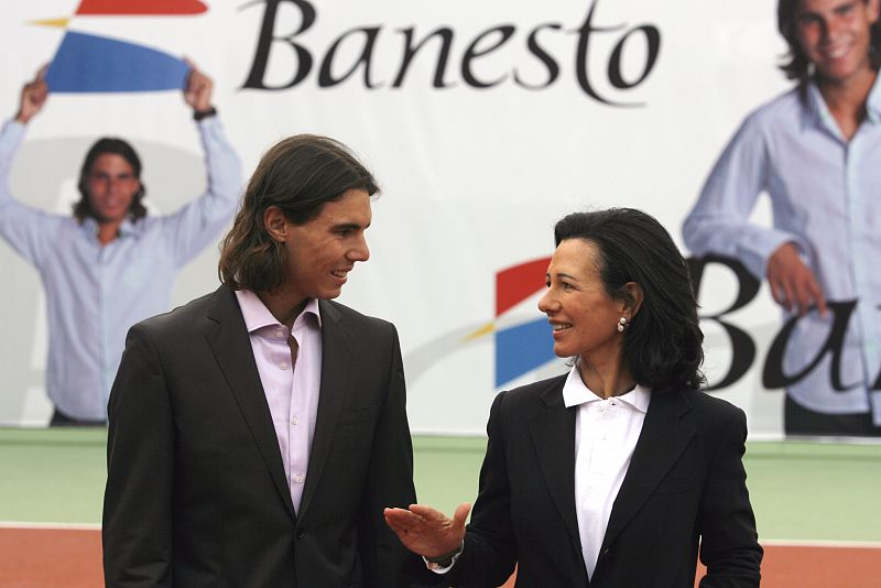 Spain's Nadal listens to Banesto chairwoman Botin during an event in Madrid
