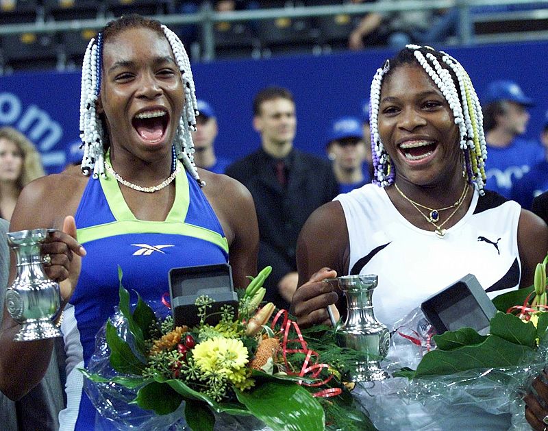 VENUS AND SERENA WILLIAMS CELEBRATE THEIR VICTORY AT EUROPEAN INDOOR OPEN.