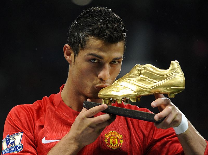 Manchester United's Ronaldo kisses golden boot trophy in a presentation ahead of their English Premier League soccer match against West Ham at Old Trafford in Manchester